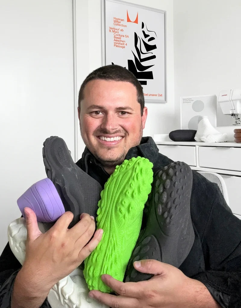 Jaren Dorman holding footwear prototypes